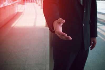 Midsection of man standing on floor