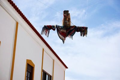 Low angle view of statue against sky