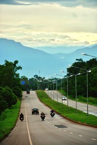 Cars on road against sky