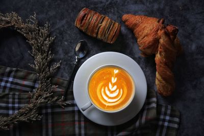 High angle view of cappuccino on table