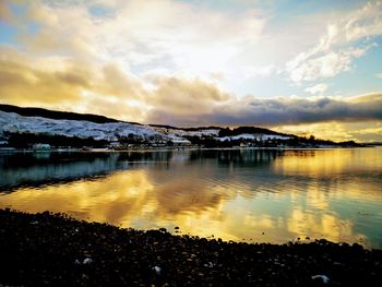 Scenic view of lake against sky during sunset