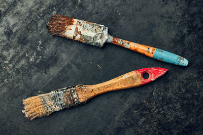 Paintbrushes on metal surface. old brush set for house maintenance. technical background