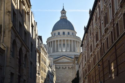 Low angle view of buildings against sky in city