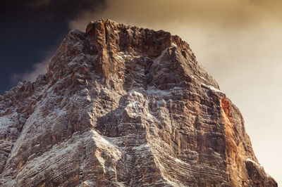 Low angle view of rock formation against sky