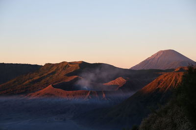 Panoramic view of volcanic mountain against clear sky