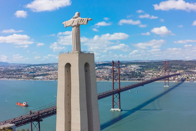 View of bridge and buildings against sky