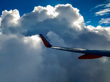 Low angle view of airplane flying in sky