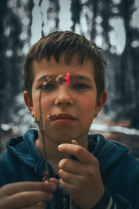 Portrait of young man in forest