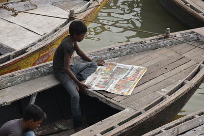 High angle view of boy and woman in water