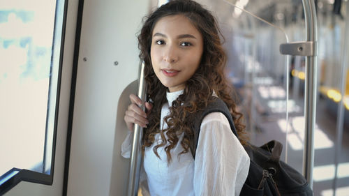 Portrait of beautiful woman in train