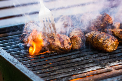 Close-up of meat on barbecue grill