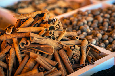 Close-up of a beautiful slide of cinnamon pods on a market showcase.