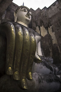 Low angle view of buddha statue