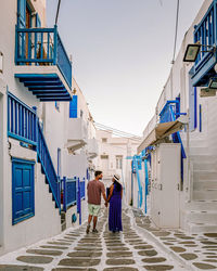 Rear view of woman walking on street