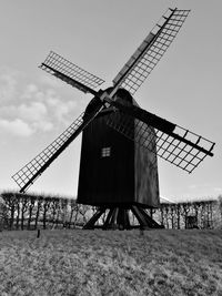 Traditional windmill against sky