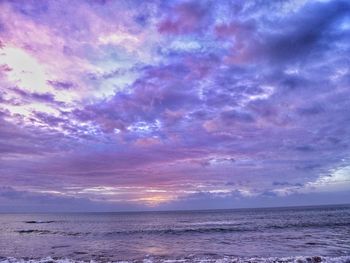 Scenic view of sea against sky at sunset