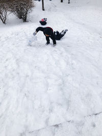 Person skiing on snow covered field