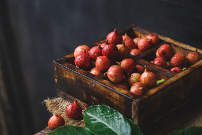 High angle view of figs in wooden box