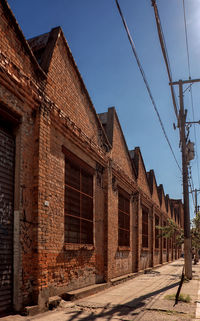 Exterior of old building factory against clear sky