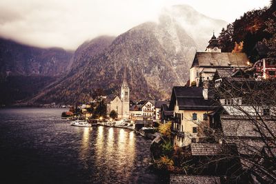 Lake by mountain against sky