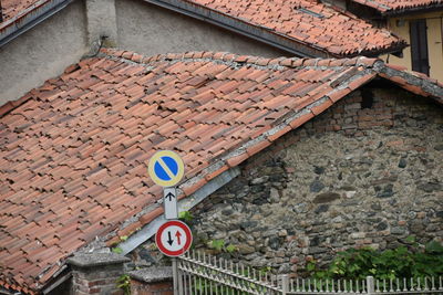 High angle view of road sign on roof of building