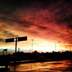 Road against cloudy sky at sunset