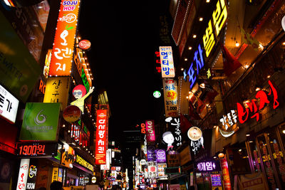 Low angle view of illuminated city at night