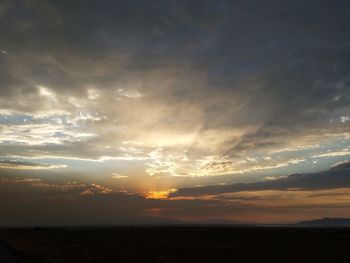 Scenic view of silhouette landscape against sky at sunset