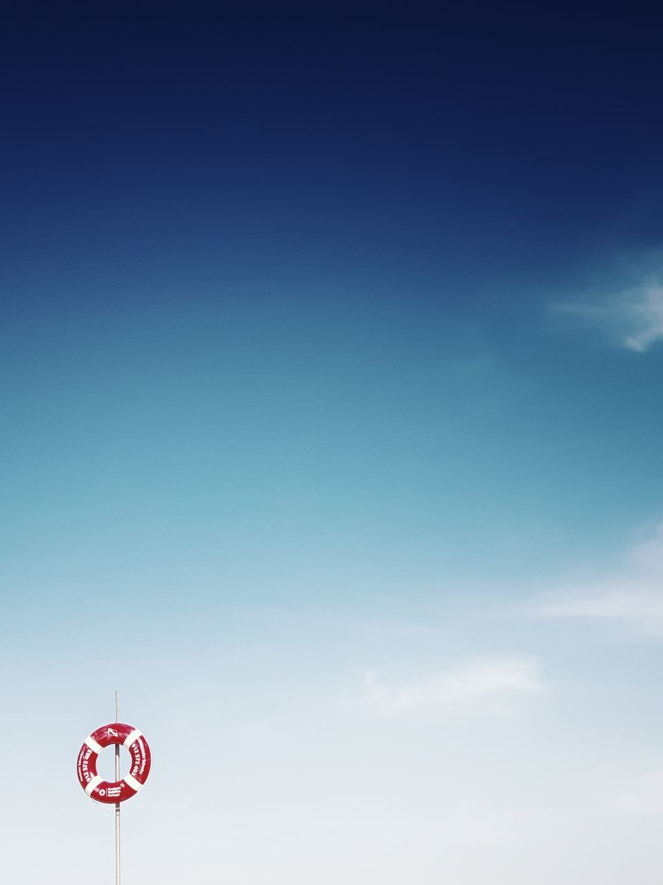 low angle view, sky, copy space, blue, cloud, day, tower, high section, outdoors, tall - high, cloud - sky, tall, tranquility, scenics, distant, no people, cloudscape, spire, global communications