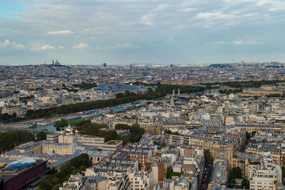 Aerial view of the city of paris with the nice seine river seen from the tour eifel