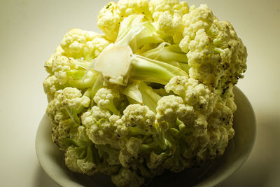 Close-up of green chili peppers on table