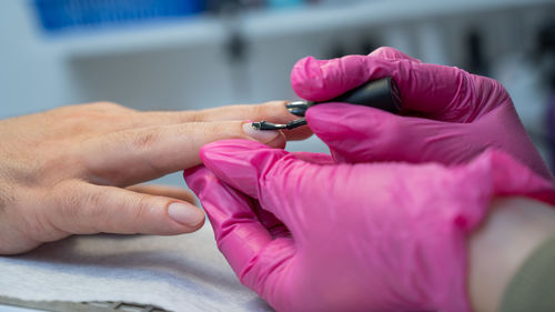 Cropped hand of doctor examining patient