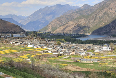 Scenic view of agricultural landscape against sky