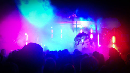 Rear view of people enjoying music concert