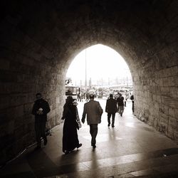 People walking in tunnel