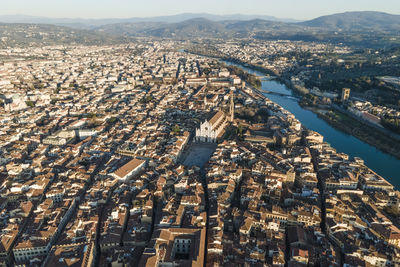 Aerial view of florence along the arno river and the old town from above, tuscany, italy,