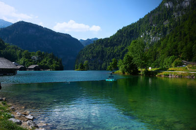 Scenic view of lake and mountains against sky