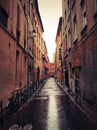 Alley amidst buildings in city