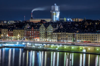 Illuminated buildings in city at night