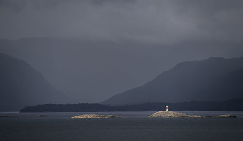 Lighthouse on a small island in the patagonian fjords