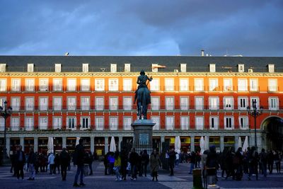 Group of people in front of building, plaza mayor, madrid, spain