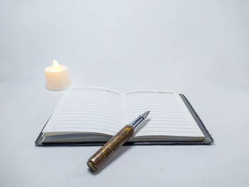 High angle view of pen on table against white background