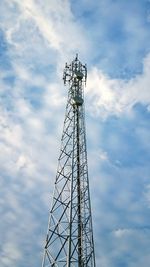 Low angle view of communications tower against sky