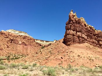 Low angle view of rock formations against sky