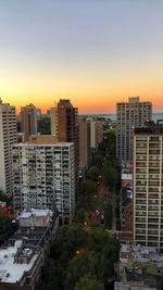 High angle view of buildings against sky during sunset