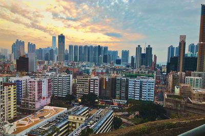 Aerial view of modern buildings in city against sky