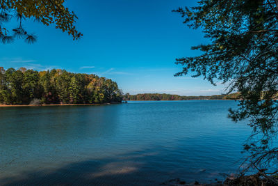 Scenic view of lake against blue sky