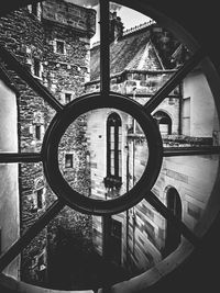 Low angle view of buildings seen through window