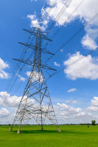 High voltage pole on wihte cloudy and blue background, electric concept