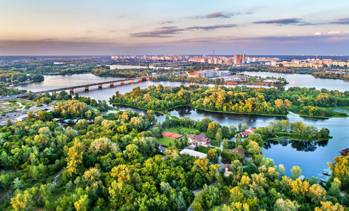 High angle view of river and cityscape against sky